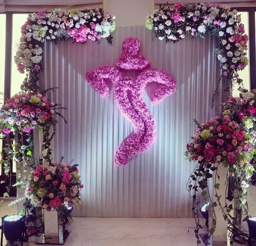 Engagement backdrop with pink floral monogram